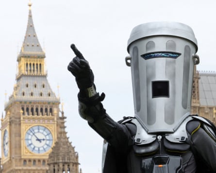 Count Binface stands with an arm raised, with Big Ben in the background