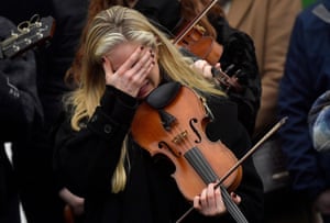 A musician reacts during the funeral of Ashling Murphy, the teacher who was murdered while out jogging, outside the St Brigid’s Church in Mountbolus.