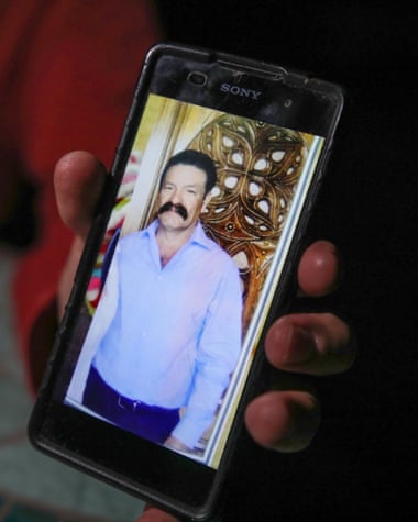 A relative shows a photograph of José Victoriano Barajas, a 57-year-old businessman who was dragged from his ranch near the town of Tecate on 8 April, 2019 and is feared dead.