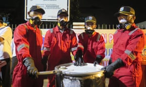 City workers in protective clothing and masks gassed the rats with sulphur.