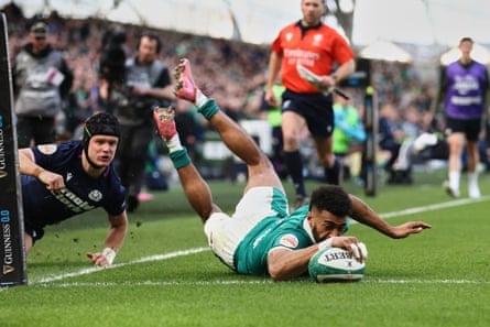 Robert Baloucoune scores a try against Scotland.