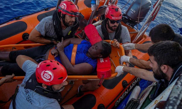 Marc Gasol (third from right wearing sunglasses) helps with a rescue effort in the Mediterranean