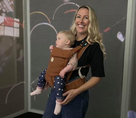 Harriett Thompson carries her child in a baby sling