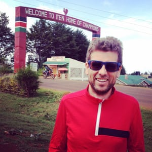 Finn beside the famous sign at the entrance to Iten, Kenya