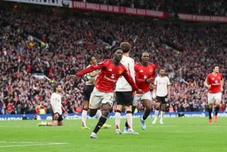 Kobbie Mainoo celebrates scoring for Manchester United against Liverpool in May