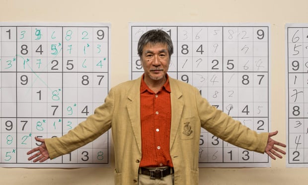 Maki Kaji in front of sudoku grids