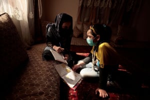 Sahar, 17, an 11th grade secondary school student, helps her sister, Hadia, 10, a 4th grade primary school student, with her homework after school at their home in Kabul. Sahar wants to become an engineer, but, for now at least, has to learn at home as best she can. “I am trying to continue my lessons at home but nevertheless the environment at school, the classroom, our friends and teachers is something different compared to being at home.”
