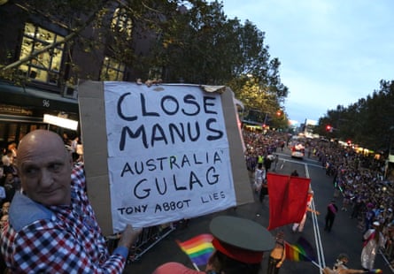 Jeff Stanton holding up a ‘Close Manus’ placard on the 78ers float.