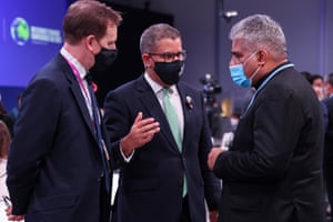 Alok Sharma, centre, MP, appeals to India’s environment minister Bhupender Yadav (right) moments before the final plenary
