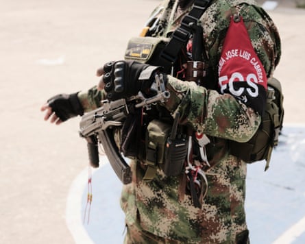 A member of the Comuneros del Sur showing his the FCS arm band.