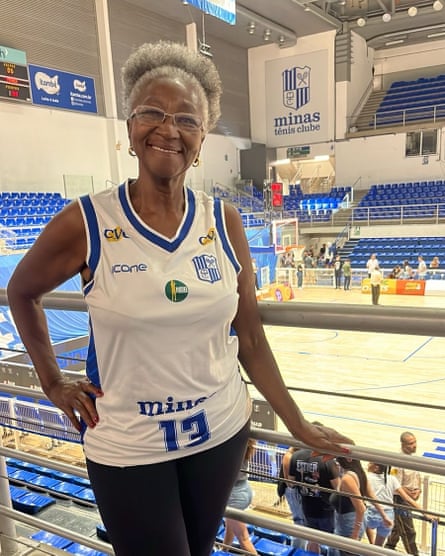 Geralda das Gracas Mendes smiles a the camera wearing a sports vest, while behind her is a basketball court.