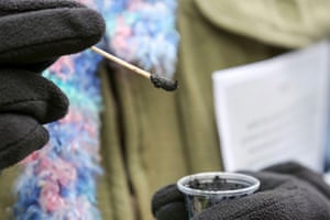 Ashes on a cotton swab at a drive-through Ash Wednesday service at Munholland United Methodist Church in Metairie, Louisiana, US