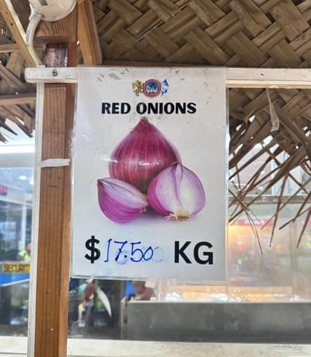 Sign showing red onions for $17.50 a kilo
