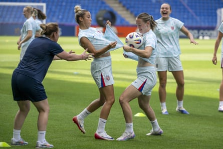 Norway players try to catch the ball with their shirt in training