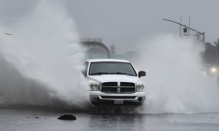 A vehicle slams into a flooded offramp at Gregory Lane on southbound I-680 in Pleasant Hill, California, as a powerful storm barreled toward the area.