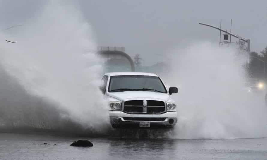 A conveyance slams into a flooded offramp astatine Gregory Lane connected southbound I-680 successful Pleasant Hill, California, arsenic a almighty tempest barreled toward the area.