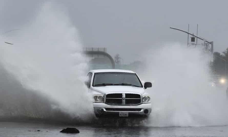 A vehicle slams into a flooded offramp in Pleasant Hill, California, on Sunday.