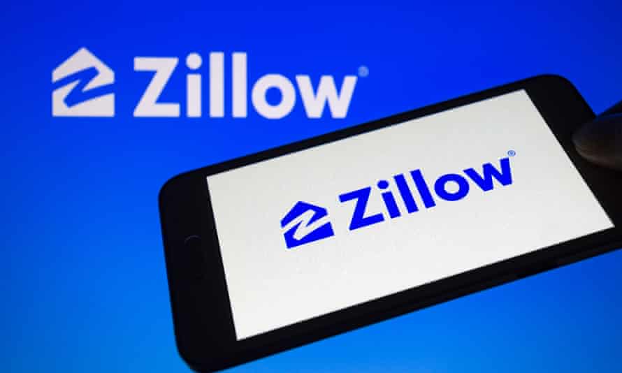 Zillow logo is seen connected a telephone screen