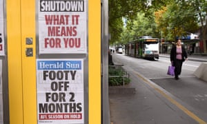 Newspaper headlines are pasted to the side of a newspaper stand in Melbourne