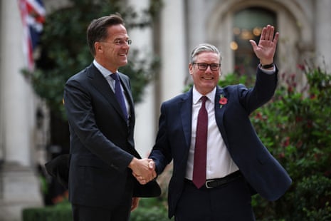 Britain's prime minister Keir Starmer greets Nato Secretary Gen Mark Rutte as he arrives to attend a meeting of the a meeting of the Coalition of the Willing, at the Foreign, Commonwealth and Development Office (FCDO) in central London on 24 October 2025.