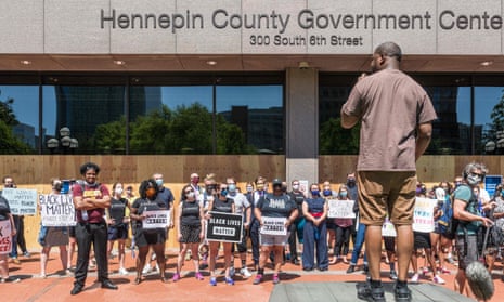 Protesters gather outside the Hennepin county Government Center in Minneapolis, Minnesota, before Derek Chauvin was charged in the death of George Floyd. 