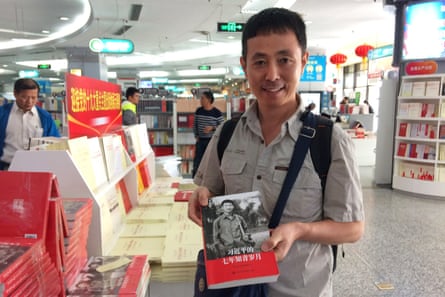 Wu Huifeng, 43, studies a new book about Xi Jinping’s youth at a bookshop in Beijing, China.
