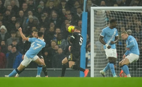 Manchester City's Phil Foden (left) sees his shot at goal headed clear by Fulham's Joachim Andersen.