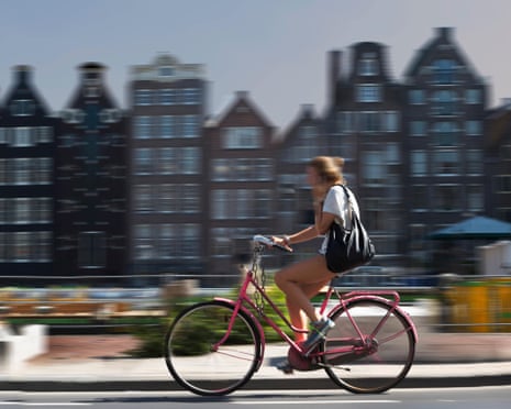 Young person on a bike in Amsterdam