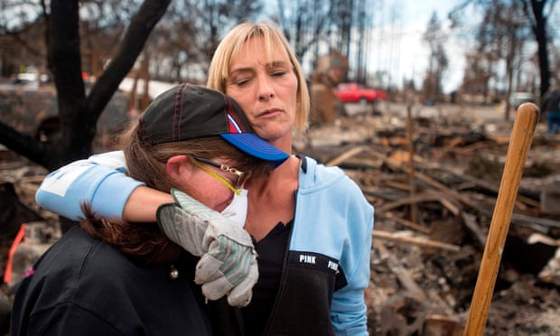 Neighbours in the Coffey Park area of Santa Rosa, California. A city councilwoman said 15,000 people had lost their homes.