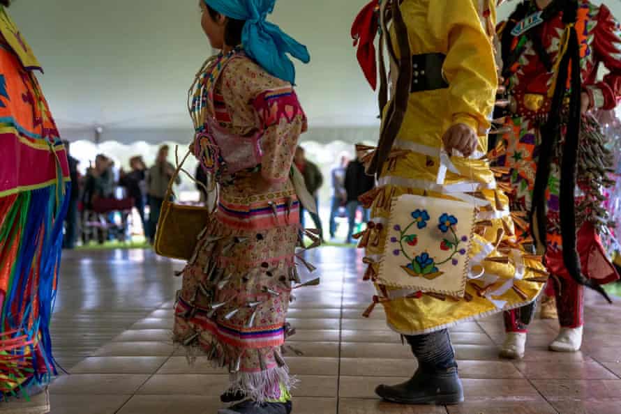Jingle dancer Aspen Decker, 29, wearing yellow at right, said she has been dancing off and on throughout her life. Jingle dress dances are traditionally healing dances.