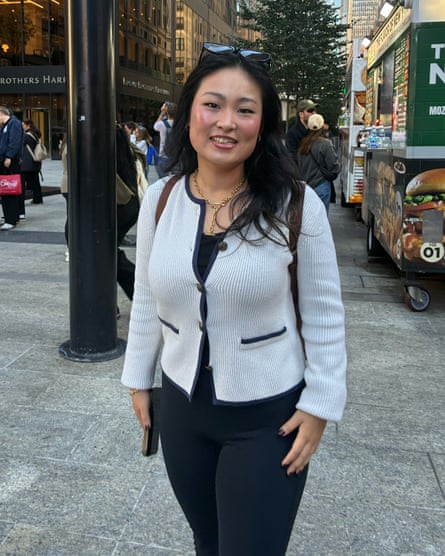 a woman in a white and black cardigan