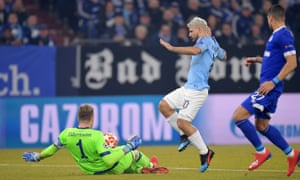 Ralf Faehrmann confronts Sergio Aguero of Manchester City.