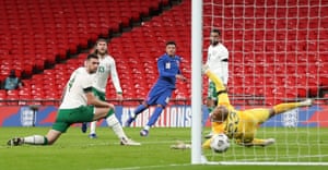 England’s Jadon Sancho (centre) scores his side’s second goal of the game.