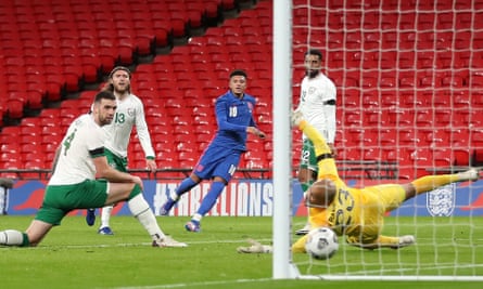 Jadon Sancho guides a precision finish past Darren Randolph to put England 2-0 up as Republic of Ireland defenders watch on helplessly.