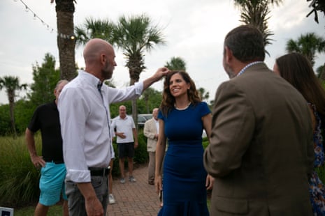 Patrick Bryant adjusts the hair of fiancée Rep. Nancy Mace at an outdoor event