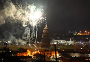 The 11th night bonfire which marks the beginning of the annual protestant 12th July celebrations is lit in the Craigyhill housing estate in Larne