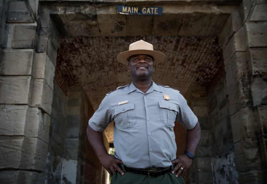 Terry Brown stands at the gate at Fort Monroe where the first move towards emancipation occurred when enslaved men Frank Baker, James Townsend and Shepard Mallory sought sanctuary during the civil war.