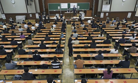 Candidates practice social distancing as they attend the annual unified college entrance examinations at the University of Tokyo.