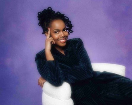 Sharon Wanjohi reclining on a white chair