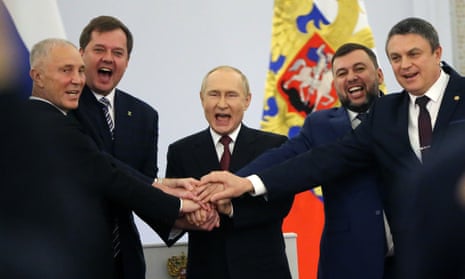 Vladimir Putin celebrates with the Moscow-appointed heads of four partially-occupied Ukrainian regions after signing ‘accession treaties’ in the Kremlin.