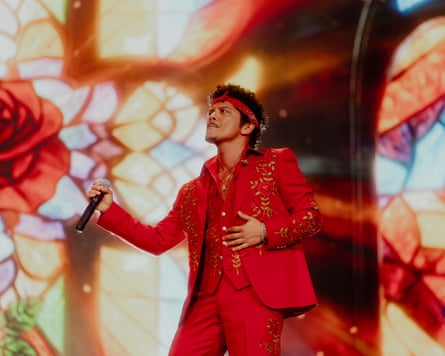 Bruno Mars in front of a psychedelic backdrop