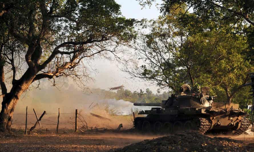A tank fires a shell towards Mullaitivu, in north-east Sri Lanka