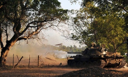 A tank fires a shell towards Mullaitivu, in north-east Sri Lanka