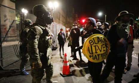 Federal police confront protesters in downtown Portland, Oregon. 