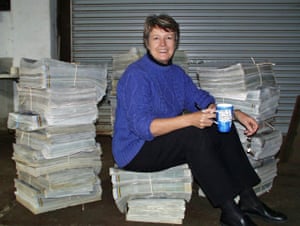 Coral Davies sits on printed copies of the Wagin Argus