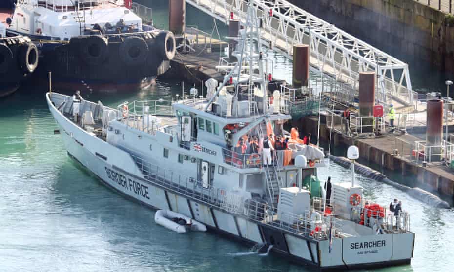 Migrants are brought ashore on the Border Force vessel Searcher in Dover earlier this year.