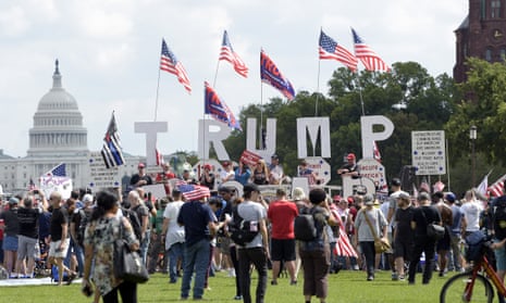 Trump supporters gather on the National Mall in Washington on Saturday for a rally - but some of his backers question his recent bipartisan moves