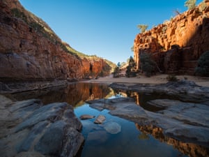 Sun hitting the red walls of Ormiston Gorge