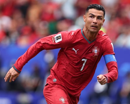 Cristiano Ronaldo leans forward as he runs