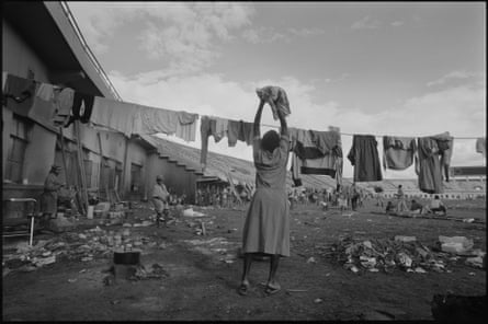 The Amahoro Stadium, Kigali. During the genocide the stadium was temporarily a “UN Protected Site” hosting up to 12,000 mainly Tutsis refugees. A woman hangs her washing as shelling and killing continued outside the stadium walls.